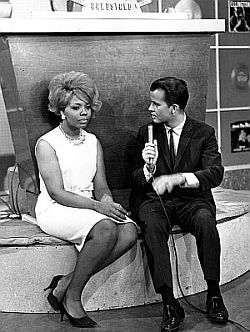 1962: Dick Clark interviewing recording artist, Mary Wells, a guest on Bandstand.