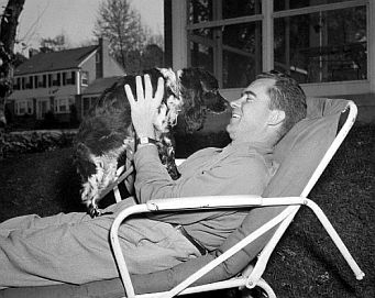 1952 Vice Presidential candidate Richard Nixon with family dog, ‘Checkers,’ among campaign gifts which Nixon sought to explain in his famous, nationally-televised September 1952 speech.