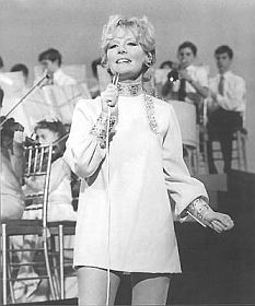 Petula Clark, performing one of her songs.