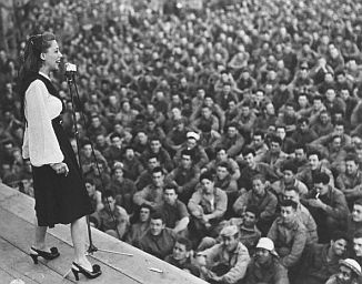 Dinah Shore, a popular singer of her day, traveled with USO tours in Europe to entertain the troops; 1943 or so.