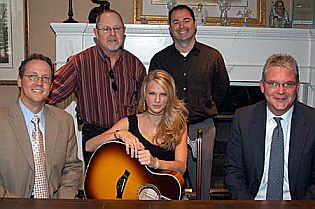 Taylor Swift at May 2005 songwriting deal with Sony/ATV. Seated from left are BMI's Shelby Kennedy, Taylor, and BMI's Perry Howard. Standing, from left, are: Sony/ATV’s 's Woody Bomar & Arthur Buenahora. Photo by Alan Mayor.