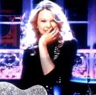 Taylor Swift expressing happy surprise to audience reaction at January 2009 SNL performance.