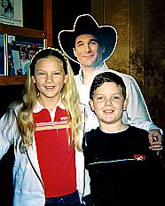 Taylor Swift, age 12, with her brother Austin and cardboard figure on a Nashville trip.
