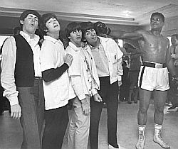 Beatles clowning with boxer Cassius Clay (later known as Muhammad Ali) during visit to Miami, FL, Feb 1964.  Photo, Harry Benson.