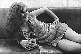 Janis Joplin & ‘Southern Comfort’ photo by Jim Marshall, shot backstage at San Francisco’s Winterland in 1968. “Janis was a great subject to photograph,” observed Marshall, “ because she was not afraid of the camera and came alive on stage... She was very real and still a little girl when she died, a very famous little girl.”