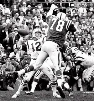 Baltimore Colts’ defensive lineman, Buba Smith (78), makes a charge at Joe Namath in Super Bowl III. Click for copy.