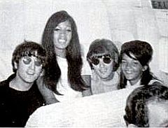 1960s photo of Ronettes & Beatles who appear to be, from left: John Lennon, Estelle Bennett, George Harrison & Nedra Talley.