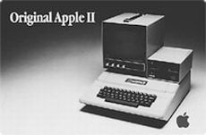 The Apple II with monitor and floppy drive mounted on computer box.