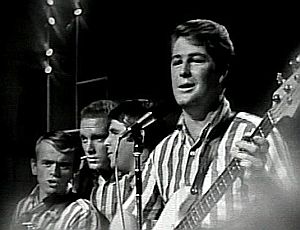 Beach Boys performing at the October 1964 TAMI concert, from left: Al Jardine, Mike Love, Carl Wilson, and Brian Wilson. Not shown Dennis Wilson on drums.
