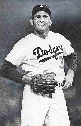 Daily Mirror/LATimes blog says this 1966 photo by Art Rodgers shows Sandy Koufax wincing in pain, but wining his 4th consecutive game, and seven for eight, May 23, 1966.