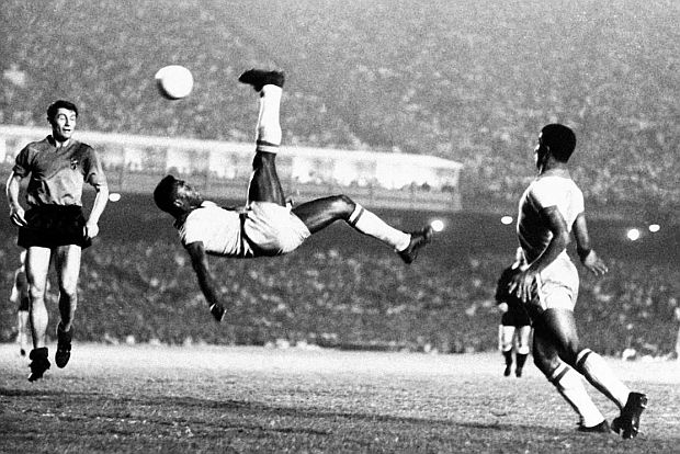 Pelé at work with famous “bicycle kick” in a September 1968 game between Brazil and Belgium in Rio de Janeiro. Associated Press photo. Click for wall print.