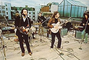 The Beatles at January 1969 London rooftop jam session (Ringo obscured; Billy Preston not shown). Click for book.
