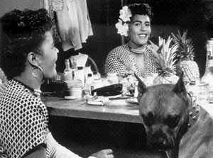 Billie Holiday loved dogs, shown here and above with her favorite boxer, “Mister,” as photographed in New York, 1946 and 1947, by William. P. Gottlieb, who worked for Down Beat jazz magazine. Click for photo print.