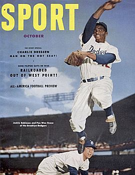 Pee Wee Reese & Jackie Robinson featured on the October 1952 cover of “Sport” magazine turning a defensive “double play” .