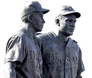 Brooklyn, NY sculpture of Pee Wee Reese left and Jackie Robinson, commemorating Reese’s May 1947 "arm-around-the-shoulders" support of Robinson during racial heckling by fans at a Cincinnati Reds game.  Photo: MLB.com.