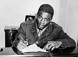 Jackie Robinson in his U.S. Army officer’s uniform, was acquitted in a court martial for a “back-of-the-bus” incident & false charges. Click for photo.
