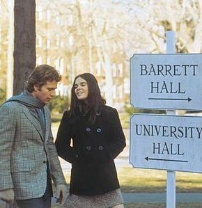 Ollie & Jenny on campus at Barrett Hall sign.