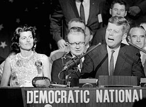 Patricia Kennedy Lawford, left, looks on as her brother, John F. Kennedy makes his remarks at the Democratic National Convention in Los Angeles, July 1960.