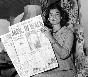 Jackie Kennedy reading about JFK’s nomination in the “Boston Globe” newspaper back home in Hyannis Port, MA, July 14, 1960. AP photo.