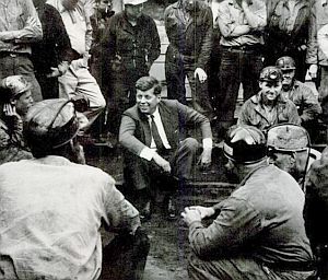 John F. Kennedy, presidential candidate, meeting with West Virginia coal miners, 1960.