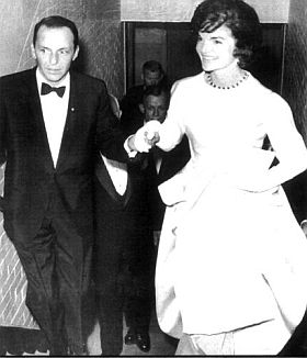 Jan 1961: Frank Sinatra escorting Jackie Kennedy to her box at the National Guard Armory for a pre-inaugural gala staged by Sinatra to help pay off JFK & Democratic Party campaign debt.
