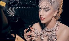 Lady Gaga appears to be scrolling on hand-held device in this screenshot from Google’s Chrome ad.