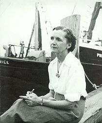 1951: Rachel Carson, Woods Hole dock at Sam Cahoon's Fish Market, just after  publication of “The Sea Around Us.” Photo E. Gray, Lear Collection.