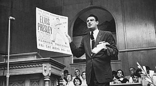 Baptist preacher Robert Gray, holding Elvis poster, denounces singer in Jacksonville, FL. Photo, R. Kelley/Life.