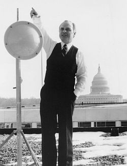 Brian Lamb, jack-of-all trades, on C-SPAN rooftop with antenna, wintry day, 1983. Photo, Cable Center.