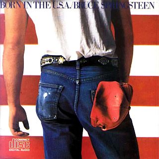 Cover of Bruce Springsteen’s “Born in the U.S.A.” album  –  No.1 on the Billboard chart in July 1984. Click for CD or digital.