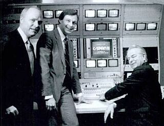 Brian Lamb at left with Sen. Robert Byrd (D-WV), far right, flipping the switch for C-SPAN 2 on June 2, 1986. Paul Fitzpatrick, center, was then president of C-SPAN.