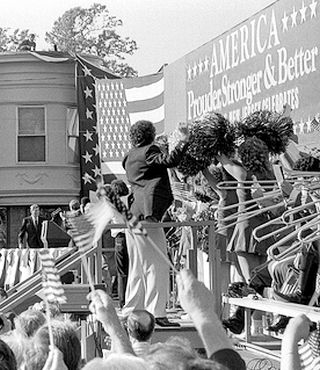 Ronald Reagan, barely visible in this photo, center left, approaching rostrum for 1984 speech at Hammonton, NJ, September 19th.  Photo, PerOwer, flicker.com.