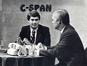 Brian Lamb, right, interviews former Oklahoma Rep. Dave McCurdy on early C-SPAN set. AP photo.