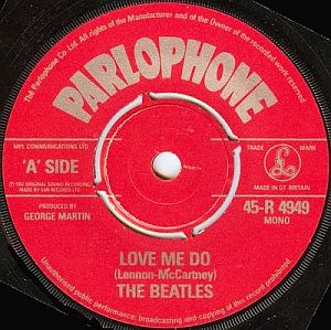 Beatles’ 1962 hit “Love Me Do” on Parlophone 45rpm label, produced by George Martin. Click for digital.