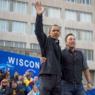 President Barack Obama and rock star Bruce Springsteen stand arm-in-arm at Madison, Wisconsin campaign rally on November 5, 2012.  Photo, Nikki Kahn/Washington Post.