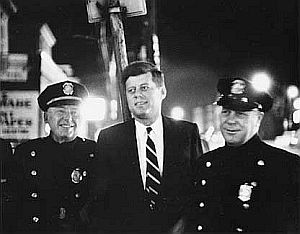 JFK visiting with two of Boston’s finest while campaigning in Massachusetts sometime in 1957.