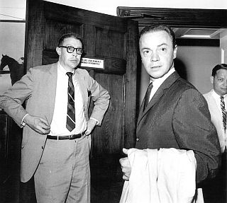 Alan Freed, center, going into closed-door hearings before a U.S. House of Representatives committee investigating “payola” in the American radio business, April 25, 1960.