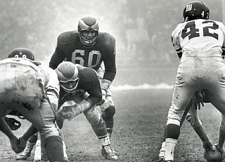 Chuck Bednarik, No. 60, at his linebacker post in a game against the New York Giants.