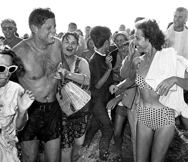 Surprised beachgoers in Los Angeles are astounded to find President John F. Kennedy swimming on their public beach.. So were ten secret service agents charged with protecting him. Photo, Bill Beebe / Los Angeles Times. 