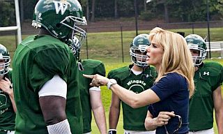 Sandra Bullock as Leigh Anne Touhy instructing Michael Oher’s character on the finer art of football aggression.