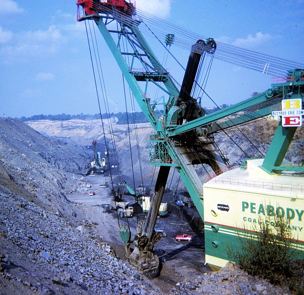1970s: Peabody Coal Co.’s “Big Hog” at work at the Sinclair Mine in Muhlenberg Co., KY, uncovering coal seams in a strip mine pit where an army of other smaller shovels and trucks load and haul the coal to TVA’s Paradise plant.