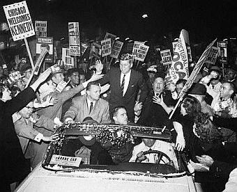 Nov 4, 1960: JFK rides in car with Chicago Mayor, Richard J. Daley, right, during torchlight parade through city.