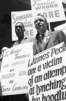 James Peck (right) and Hank Thomas march in a picket line outside the Port Authority Terminal in New York City.