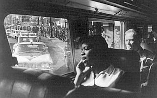 May 1961: Photo from inside bus departing from Mont-gomery for Jackson with police & Nat’l Guard escort.
