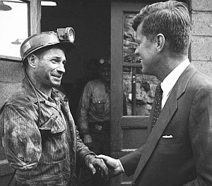 April 1960: JFK shakes hands with a one-armed coal miner while campaigning in Mullens, WV. Photo/Hank Walker.