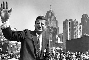 Aug 26, 1960: JFK waves to crowd as he leaves Cobo Hall in Detroit following speech to the VFW National Conven-tion.  Photo, Tony Spina/Walter Reuther Library