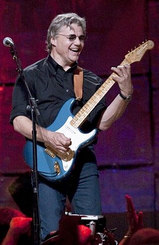 Steve Miller performing with guitar in recent years.