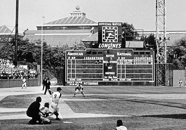 October 1960; Forbes Field, Pittsburgh, Pennsylvania: No. 9 of the Pittsburgh Pirates, Bill Mazeroski, has just hit a pitch that is heading for the trees beyond the left field wall. It is an historic home run, occurring in the bottom of the ninth inning in Game 7, a walk-off home run that wins the World Series, beating the favored NY Yankees. Photo, Marvin E. Newman. Click for copy.