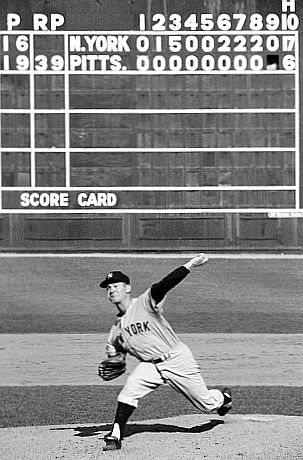 Yankee Whitey Ford in the 9th inning of Game 6 of the 1960 World Series at Forbes Field, with scoreboard telling the tale. Yanks 12, Pirates 0.  Photo, N. Leifer