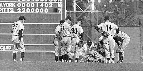8th inning, Game 7, 1960 World Series, manager Casey Stengel (37), coming to see injured Yankee shortstop, Tony Kubek, hit in the Adams Apple of his throat after a ground ball took a bad hop, swelling his wind pipe.